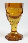 A GOOD BOHEMIAN AMBER OCTAGONAL GOBLET. 6ins high.