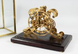 A GOOD SKELETON CLOCK in a glass dome. 8.5ins high.