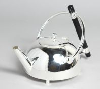 A CHRISTOPHER DRESSER DESIGN CIRCULAR SILVER PLATED TEA POT.