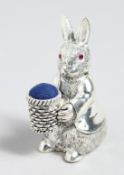 A SILVER PLATED RABBIT PIN CUSHION.