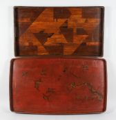 TWO JAPANESE TRAYS, one parquetry, the other lacquer. 29ins x 16ins and 27ins x15ins.