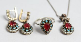 A SILVER AND GILT THREE PIECE SET.