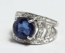 A SUPERB 18CT WHITE GOLD SAPPHIRE RING with diamond shoulders.