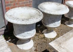A PAIR OF CARVED WHITE MARBLE URNS ON STANDS. Urns 40.5