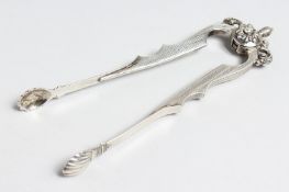 A PAIR OF SILVER SUGAR TONGS.