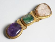 A SUPERB BUCKLE set with three stones.