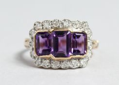 A 9CT GOLD EMERALD CUT AMETHYST AND DIAMOND RING.