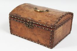 AN 18TH CENTURY LEATHER DOMED BOX with brass studs. 11ins long.
