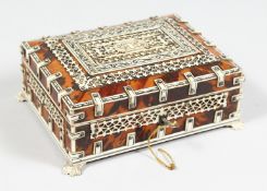 A GOOD VIZAGAPATAM TORTOISESHELL AND IVORY BOX on claw feet. 6ins long.