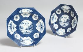 A PAIR OF WORCESTER POWDER BLUE OCTAGONAL PLATES with Chinese vignettes. 6.75ins diameter.