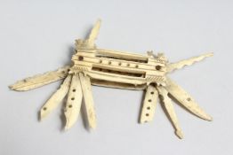 A NAPOLEONIC CARVED BONE PEN KNIFE SET with six various folding knives. 3ins long.