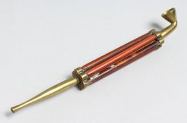 AN UNUSUAL OPIUM PIPE. 8ins long.