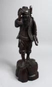 A CHINESE CARVED ROSEWOOD FISHERMAN. 15ins high.