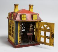 A RARE PAINTED CAST IRON NOVELTY BANK. 6.25ins high, 4.5ins square.