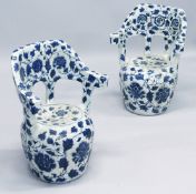 A PAIR OF BLUE AND WHITE BARREL SEATS