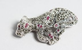 A SILVER AND MARCASITE PANTHER BROOCH.