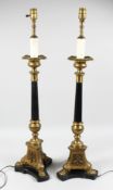 A PAIR OF BRONZE AND MARBLE COLUMN LAMPS. 36ins high.
