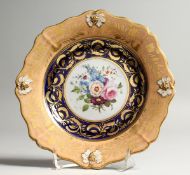 A GOOD COALPORT PLATE painted with flowers. 7.5ins diameter.