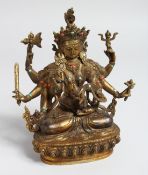 AN ASIAN GILT BRONZE MULTI ARMED DEITY set with turquoise and coral, 8.5ins high.