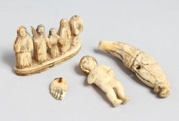 A SMALL EUROPEAN CARVED BONE BABY, 2ins long, a carved tooth and a religious group (3).