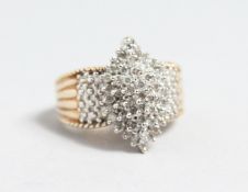 A 10CT GOLD DIAMOND SET MARQUISE RING.