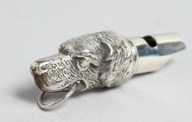 A CAST SILVER DOG'S HEAD WHISTLE, 2ins long.