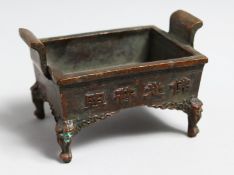 A SMALL CHINESE RECTANGULAR CENSER the sides with caligraphy, 3.75ins wide.
