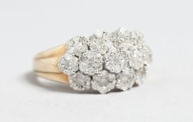A 9CT GOLD DIAMOND CLUSTER DAISY RING.