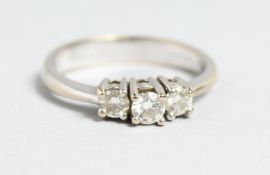 AN 18CT WHITE GOLD THREE STONE DIAMOND RING
