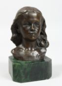 A BRONZE BUST OF A YOUNG GIRL. Signed, 4ins on a marble plinth.