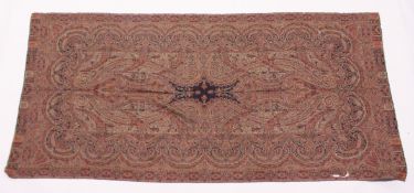 A KASHMIRI SHAWL woven in reds, creams and black to a Paisley design. 7ft x 3ft 4ins.