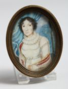 A FRAMED OVAL MINIATURE OF A LADY. 2.25ins x 1.75ins.