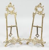 A PAIR OF BRASS EASELS.