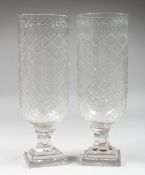 A PAIR OF CUT GLASS HURRICANE LAMPS. 14ins high.