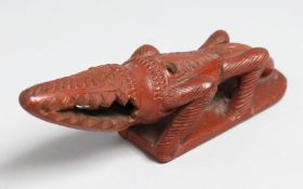 A TERRACOTTA BATH RASP. 7ins long.