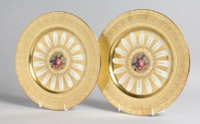 A GOOD PAIR OF AYNSLEY FRUIT PLATES with gold borders. 10ins diameter.