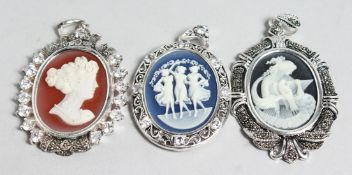 THREE CAMEO PENDANTS.