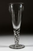 A LARGE PLAIN GLASS TAPERING GLASS with twisted stem. 11ins high.