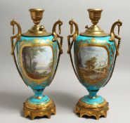 A VERY GOOD PAIR OF 19TH CENTURY SEVRES PALE BLUE LAMPS with reverse panels of figures and