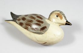 A PAINTED WOODEN DECOY DUCK. 9ins long.