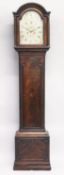 A GEORGE III MAHOGANY LONGCASE CLOCK with eight day movement, silvered and engraved arch dial with