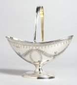 A GOOD VICTORIAN GEORGIAN SHAPED SUGAR BASIN with swivel handle and engraved garlands. London