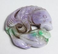 A LILIAC CARVED JADE PENDANT with seal mark 2.25ins.