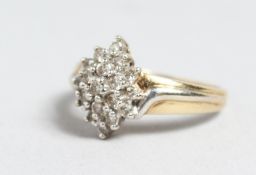 A 14CT GOLD DIAMOND MARQUISE RING.