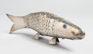 A SILVER ARTICULATED FISH