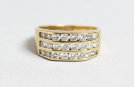 A 9CT GOLD THREE ROW DIAMOND RING.