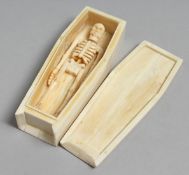 A BONE COFFIN AND SKELETON. 4.5ins.
