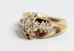 A 14CT GOLD DIAMOND CLUSTER RING