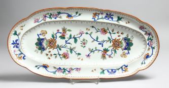 AN EARLY HERAND PORCELAIN LONG DISH with Chinese design. Impressed mark, 19ins long.