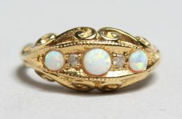 A SILVER GILT OPAL AND DIAMOND RING.